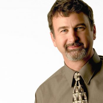 Portrait of male business man in studio on white background.