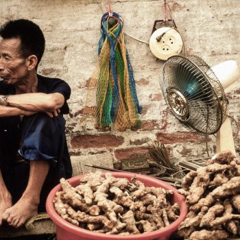 Vendor selling ginger at market in Guangzchou (Canton), China