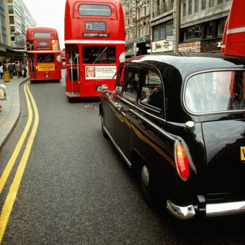 Double decker buses and London taxi, London, England, UK