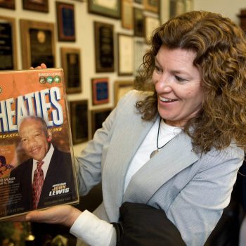 Freedom's Ride. Teacher with box of Wheaties in Congressman John Lewis' office. Washington DC, High school students retracing the Civil Rights Movement of the 1960's, Kelly/Mooney Photography