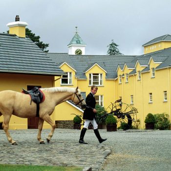 Man walking horse, Sheen Falls Lodge, Ireland