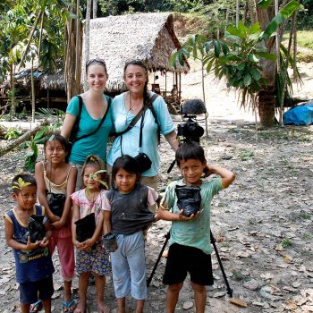 Erin Kelly and Gail Mooney with children in Amazonian village, Peru. Opening Our Eyes Movie