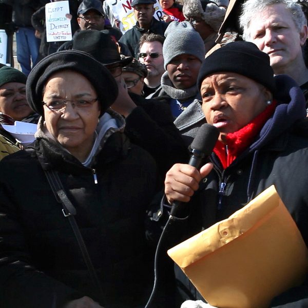 Marian Kramer and Maureen Taylor speaking in protest at the State Capitol in Lansing, Michigan, Opening Our Eyes