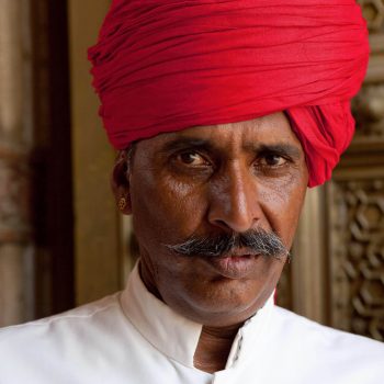 Man in red turban, Red Fort, Jaipur, India. Opening Our Eyes Movie.