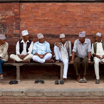 Men on bench, Kathmandu, Nepal. Opening Our Eyes Movie.