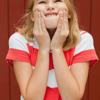 Portrait of adolescent girl in striped shirt.