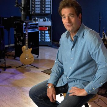 Portrait of Huey Lewis in recording studio.