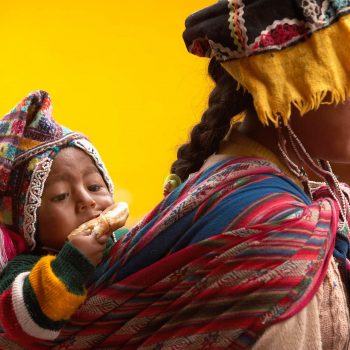 Mother with baby on back, Peru